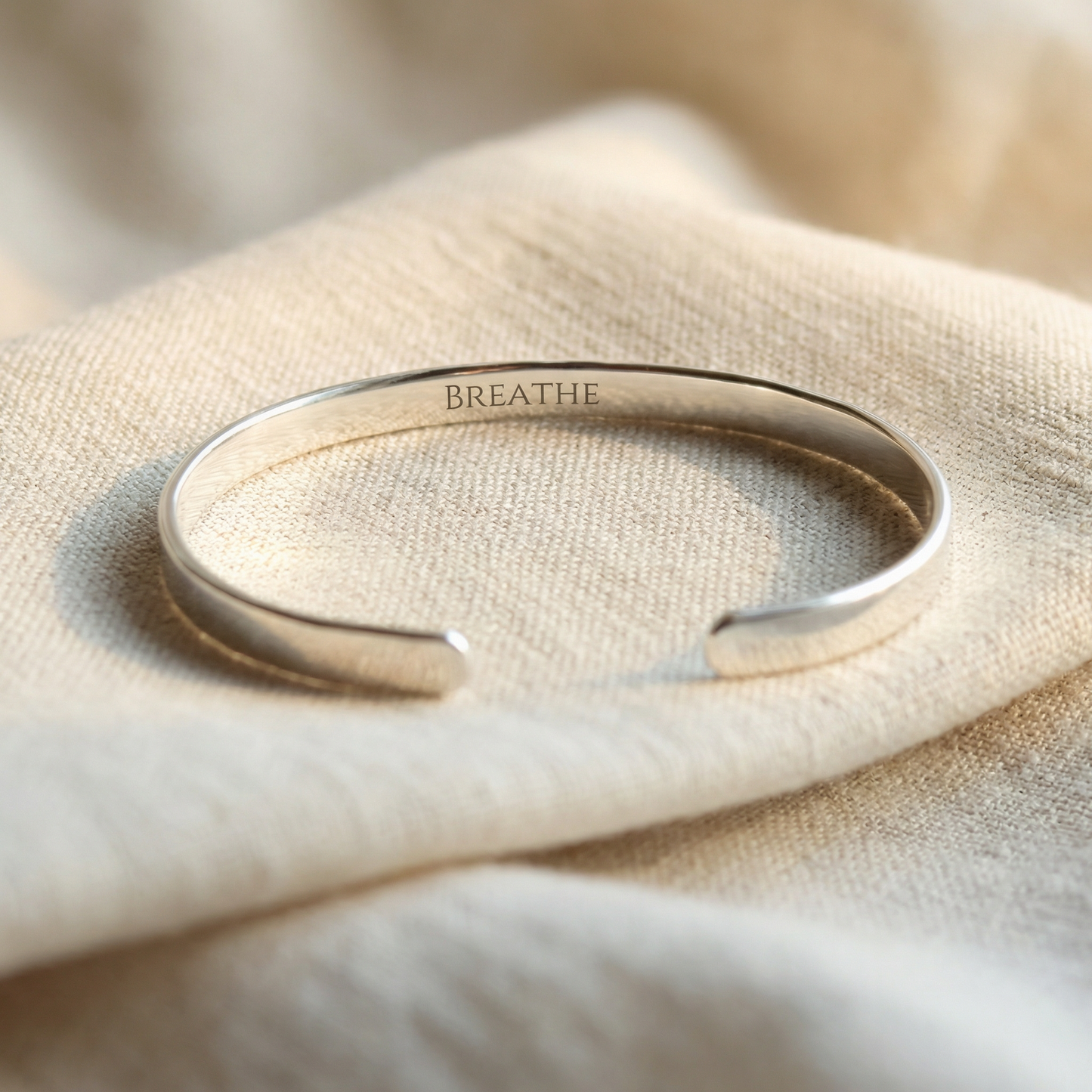 Close-up of custom engraving on sterling silver cuff bracelet