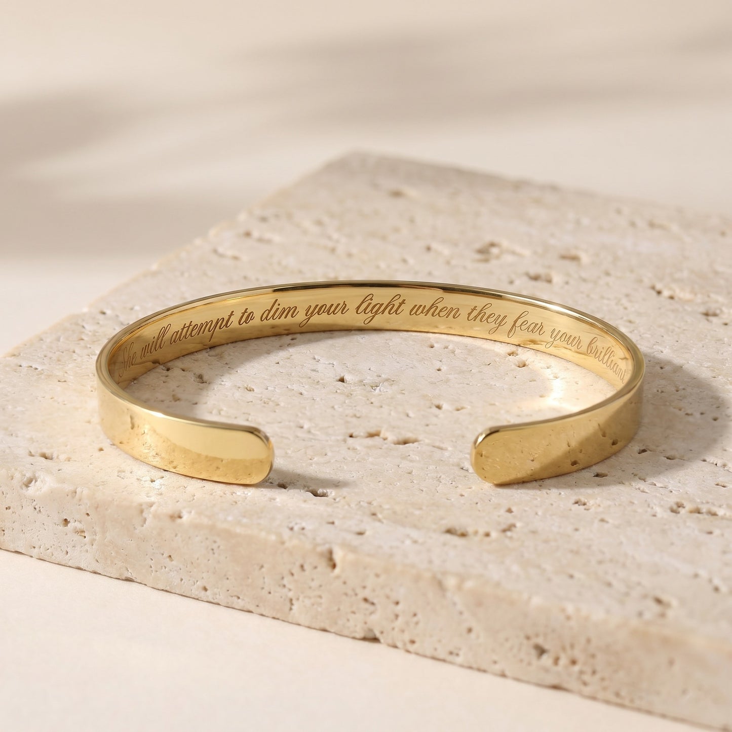 gold plated bracelet with text inside