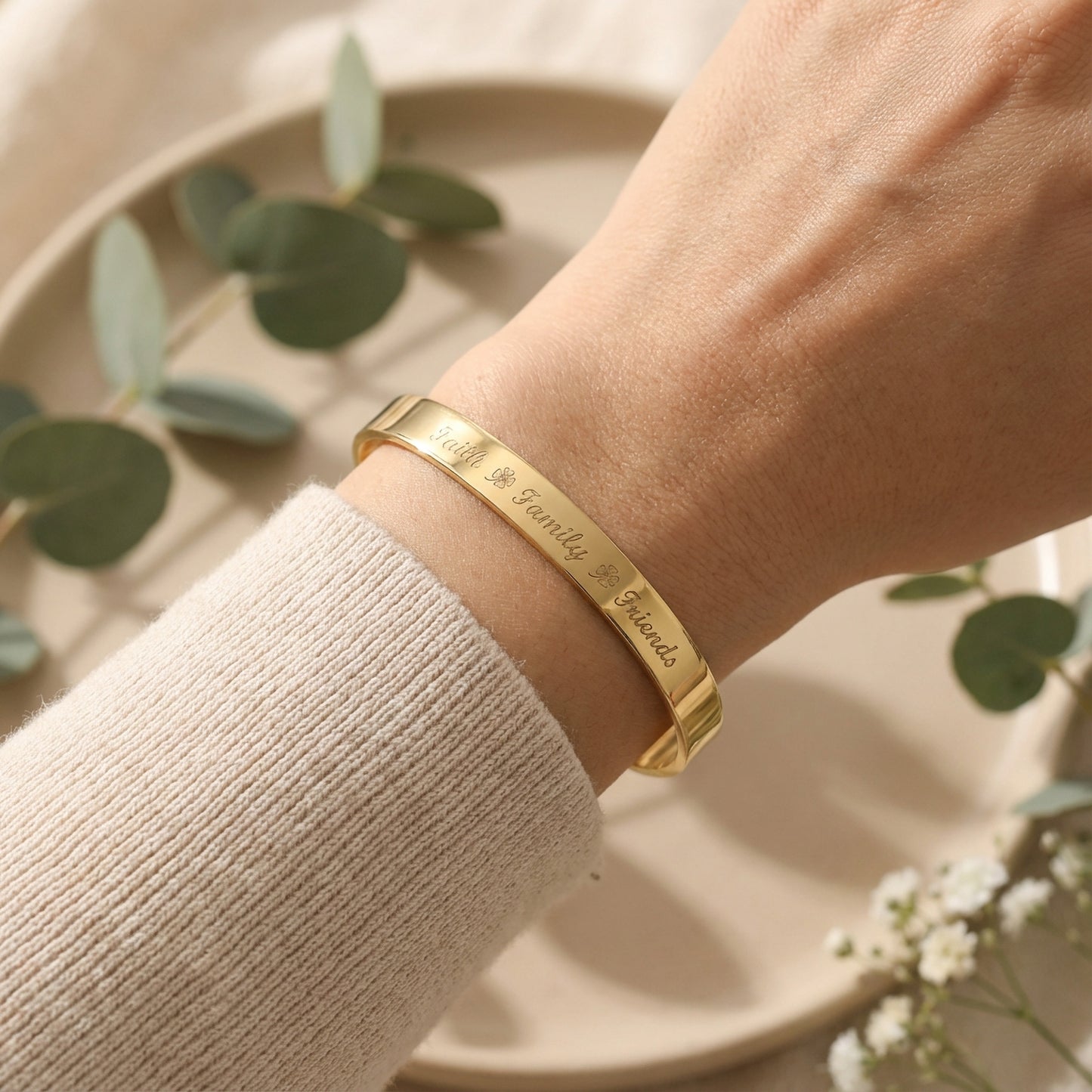 Wide gold plated cuff bracelet with inspirational quote engraving