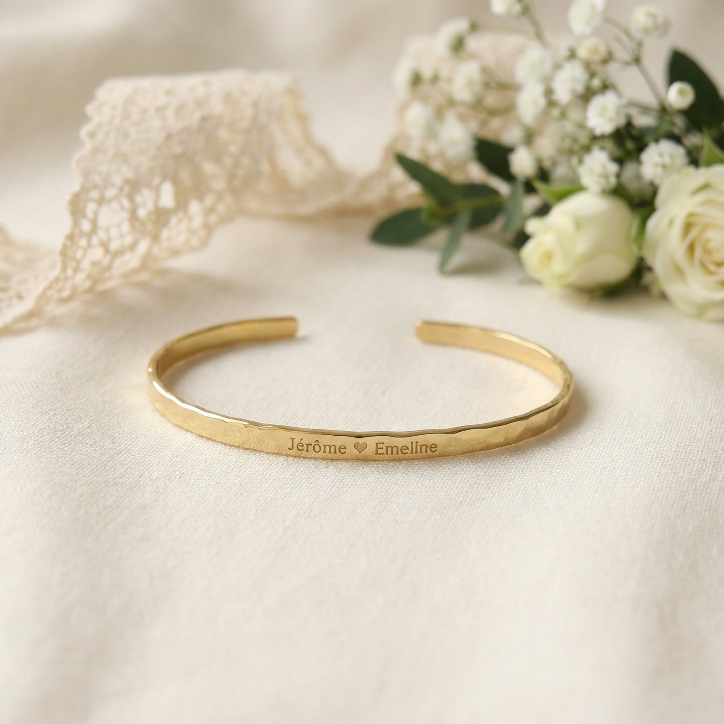 Narrow gold plated cuff bracelet with engraved names and heart symbol